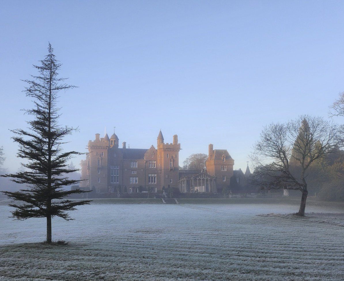 Kinnaird Castle across misty parkland